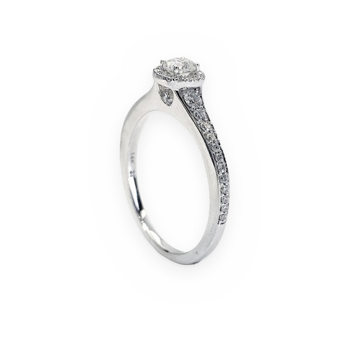 White gold round diamond halo engagement ring with pave shoulders, angled view