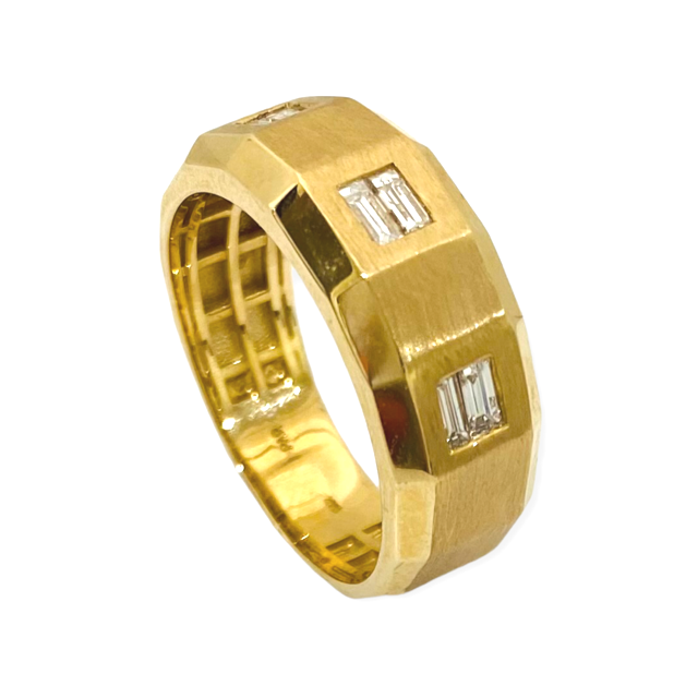 Brushed yellow gold band with flush-set baguette diamonds, angled view