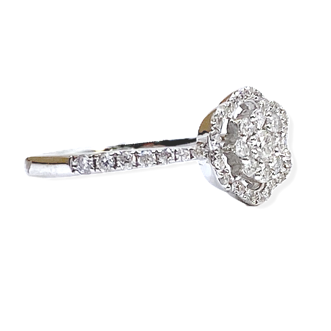Side profile of a white gold diamond cluster flower halo ring