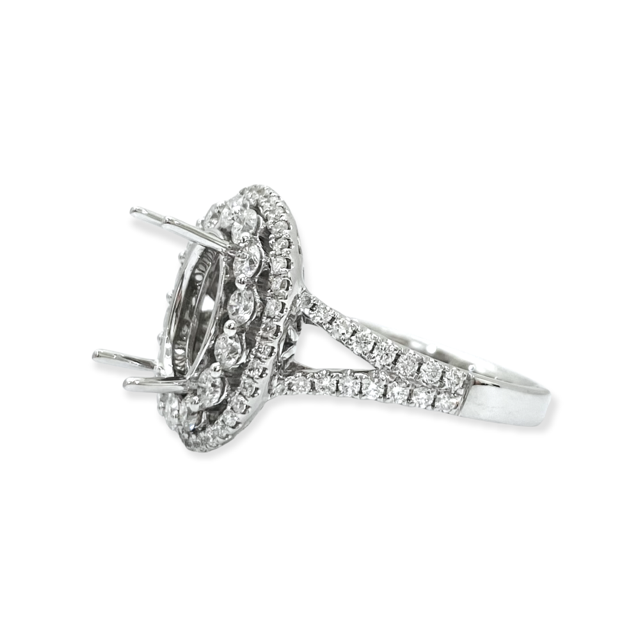 White gold oval double-halo diamond engagement ring semi-mount viewed from the side showing empty basket