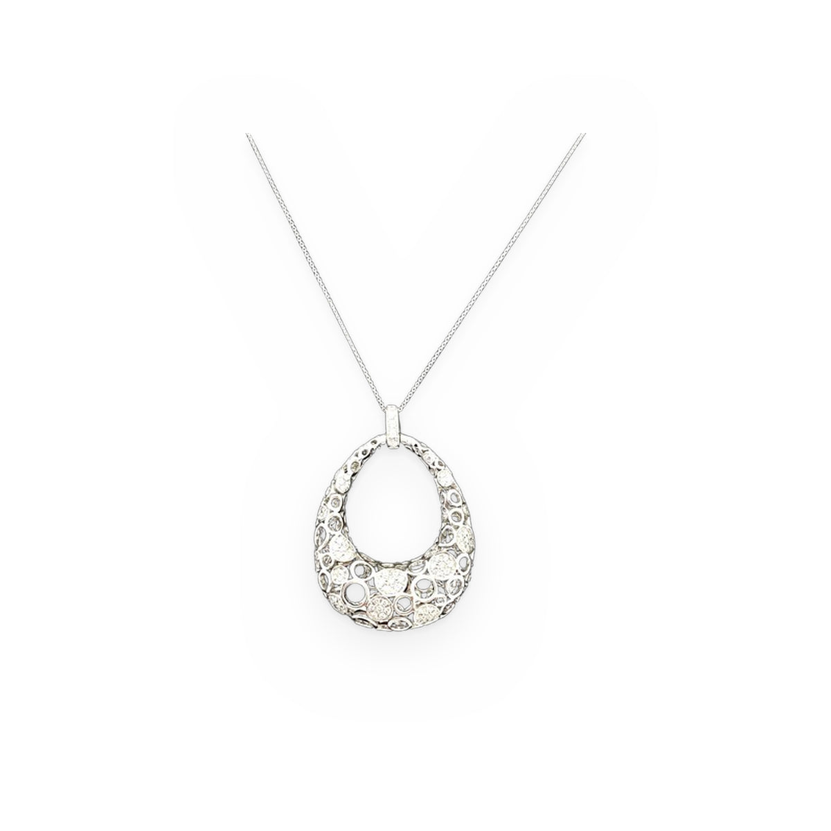 White gold diamond openwork teardrop pendant necklace on black background