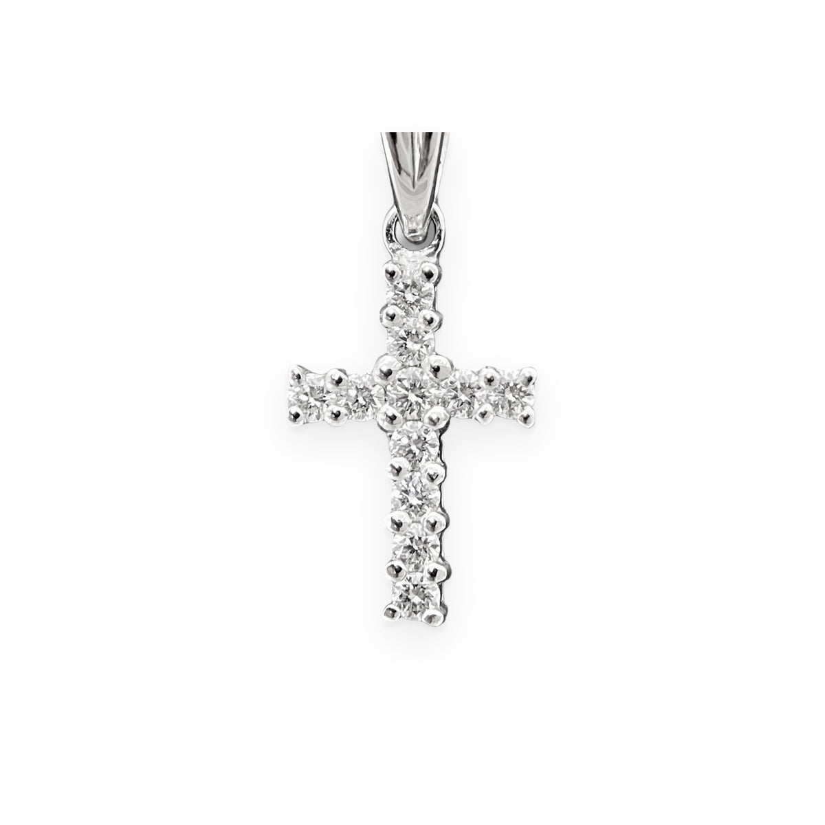White gold diamond cross pendant, close-up