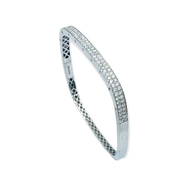 White gold cushion bangle with double-row pave diamonds, angled view