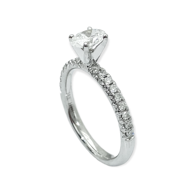 Angled view of a white gold oval diamond solitaire engagement ring