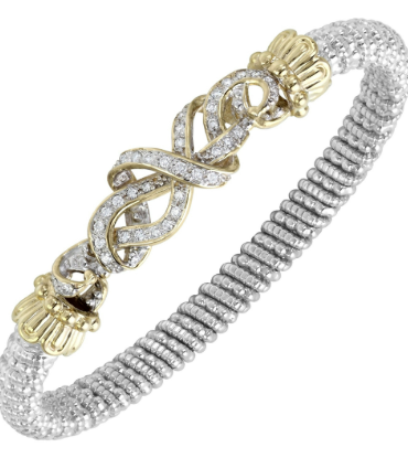 Two-tone silver and gold ribbed bangle with pave diamond woven-knot center