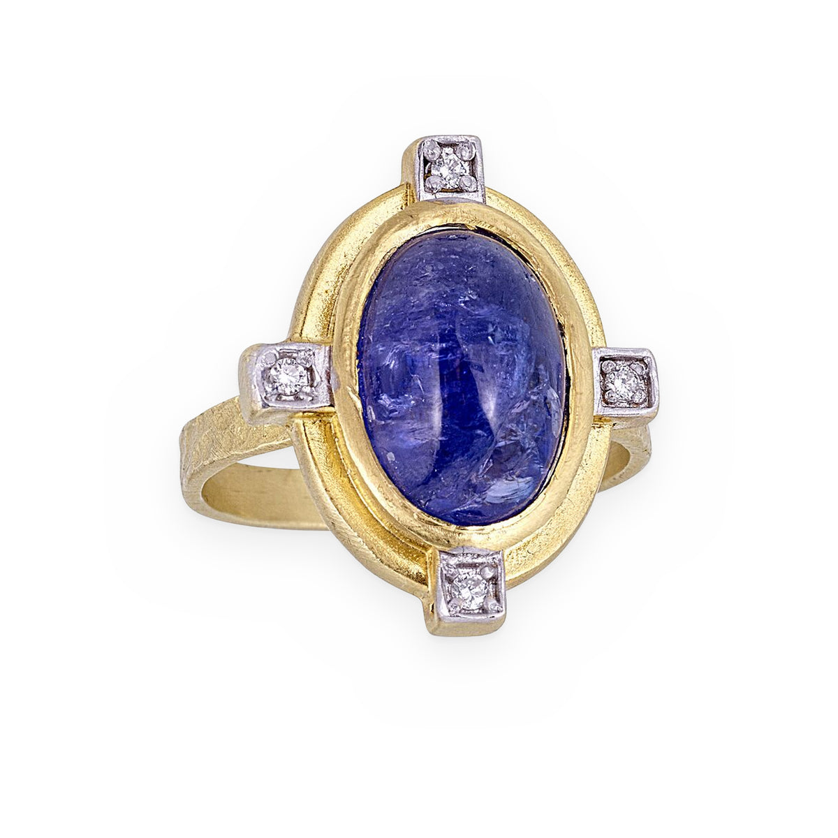 Two-tone gold ring with oval blue sapphire cabochon and four diamond accents