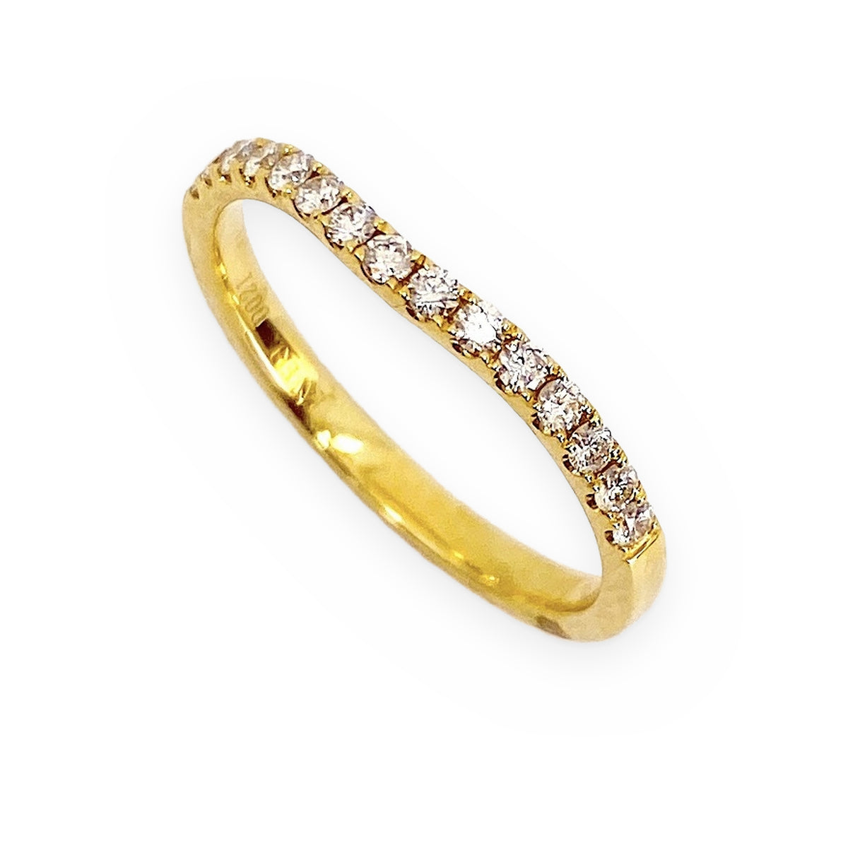 Yellow gold curved diamond wedding band at an angle