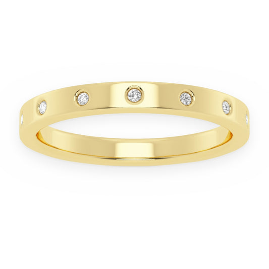 Yellow gold flush-set diamond band with scattered round diamonds