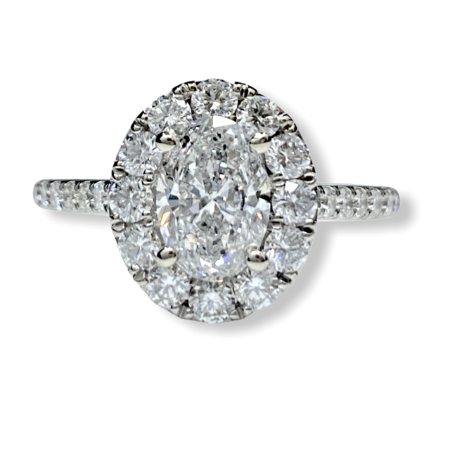 Oval diamond halo engagement ring in white gold