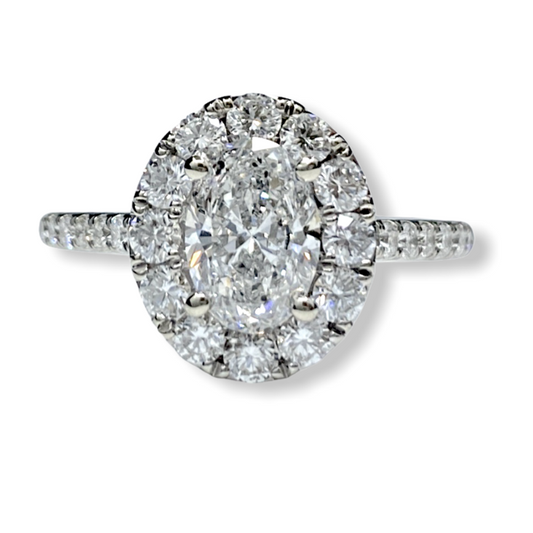 Oval diamond halo engagement ring in white gold