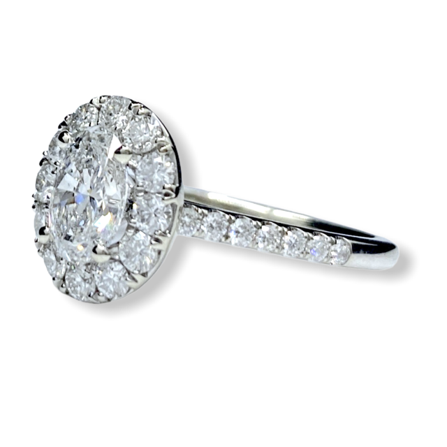 Oval diamond halo engagement ring, side profile, white gold