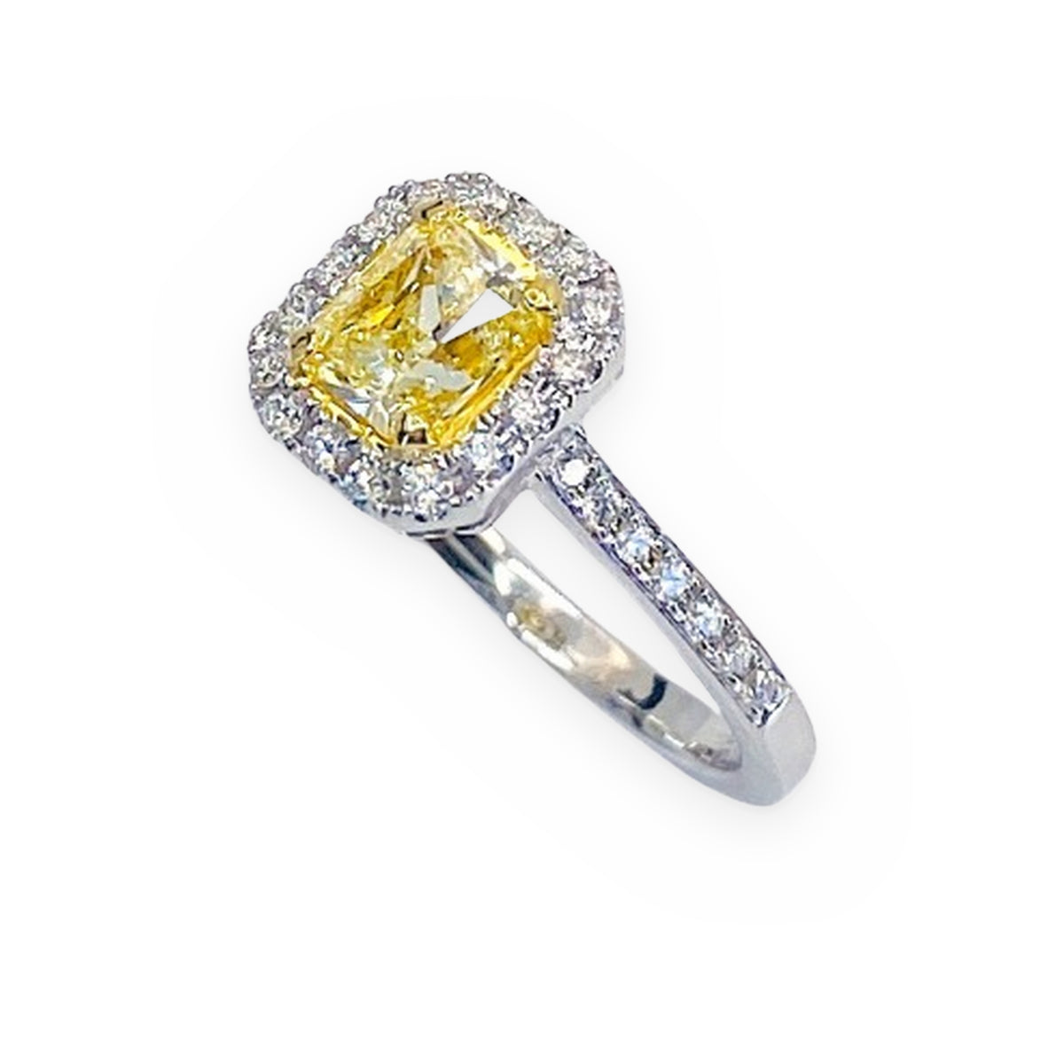 White gold fancy yellow radiant-cut diamond halo engagement ring with diamond-set band