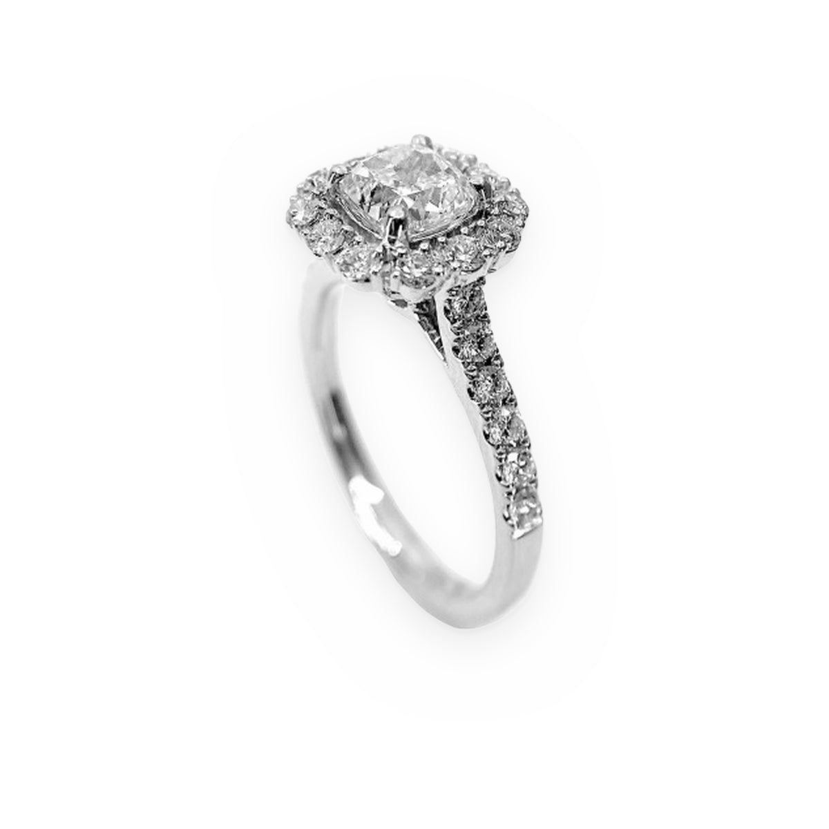 White gold cushion-halo diamond engagement ring, three-quarter angle showing pave band