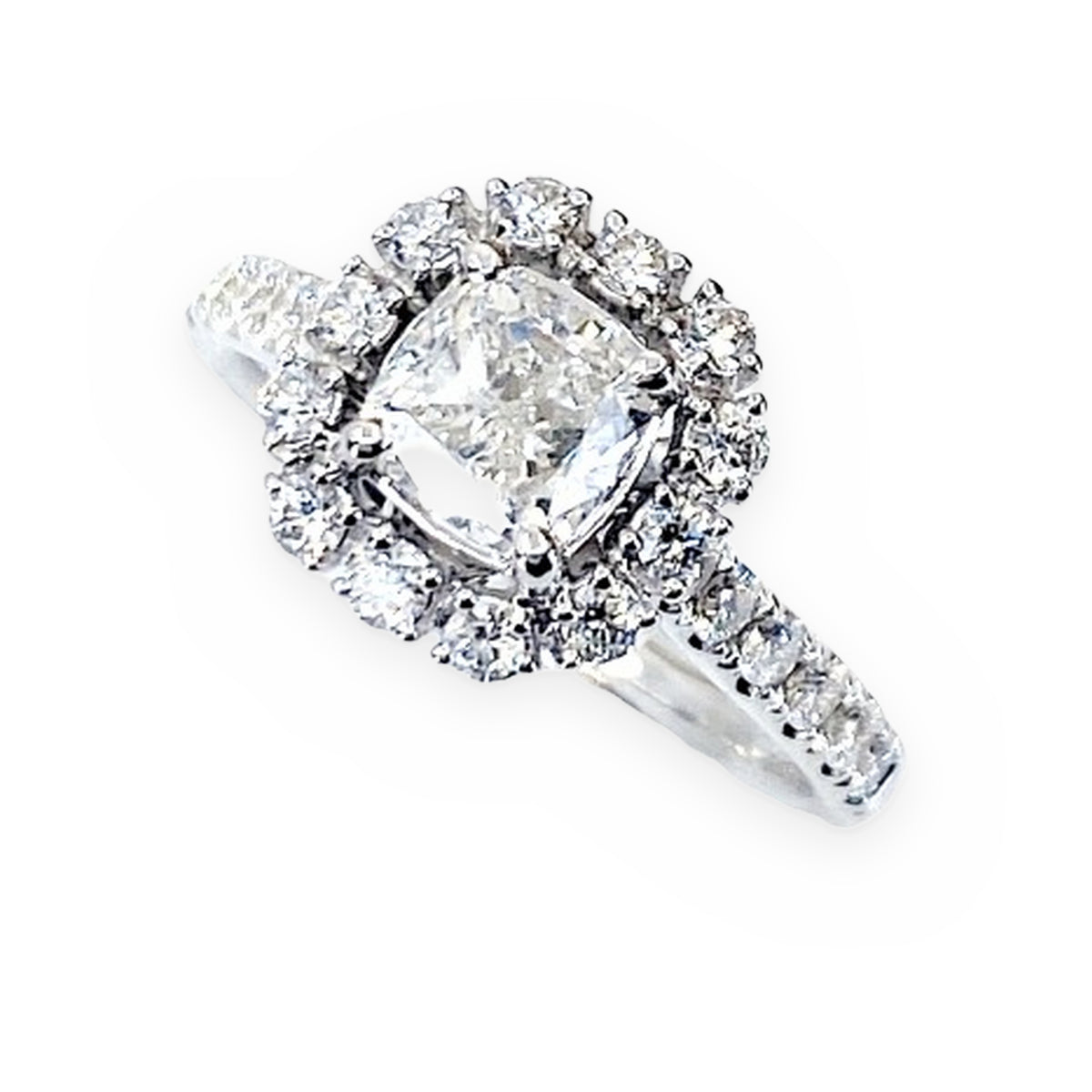 White gold cushion-halo diamond engagement ring at an angled top view