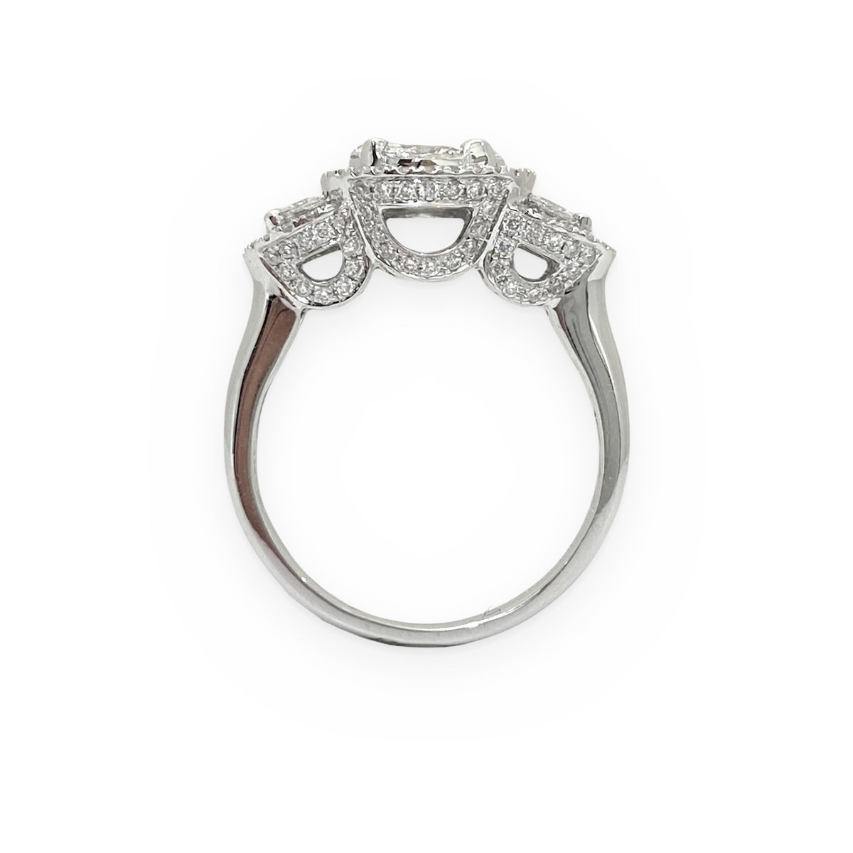 White gold three-stone halo diamond ring, top-down view showing pave galleries