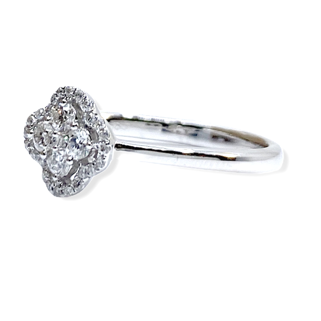 White gold clover-shaped diamond cluster halo ring, three-quarter angle