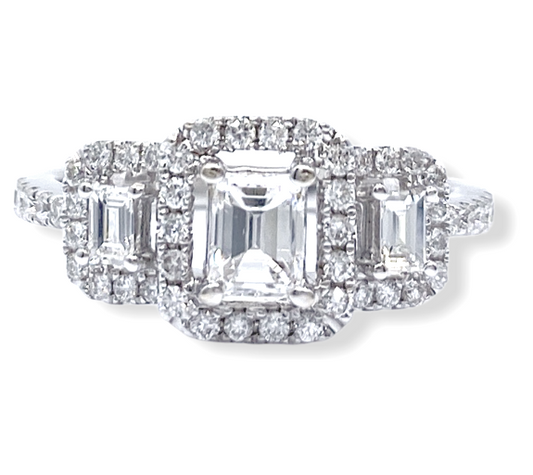 White gold three-stone emerald-cut diamond halo engagement ring, front view