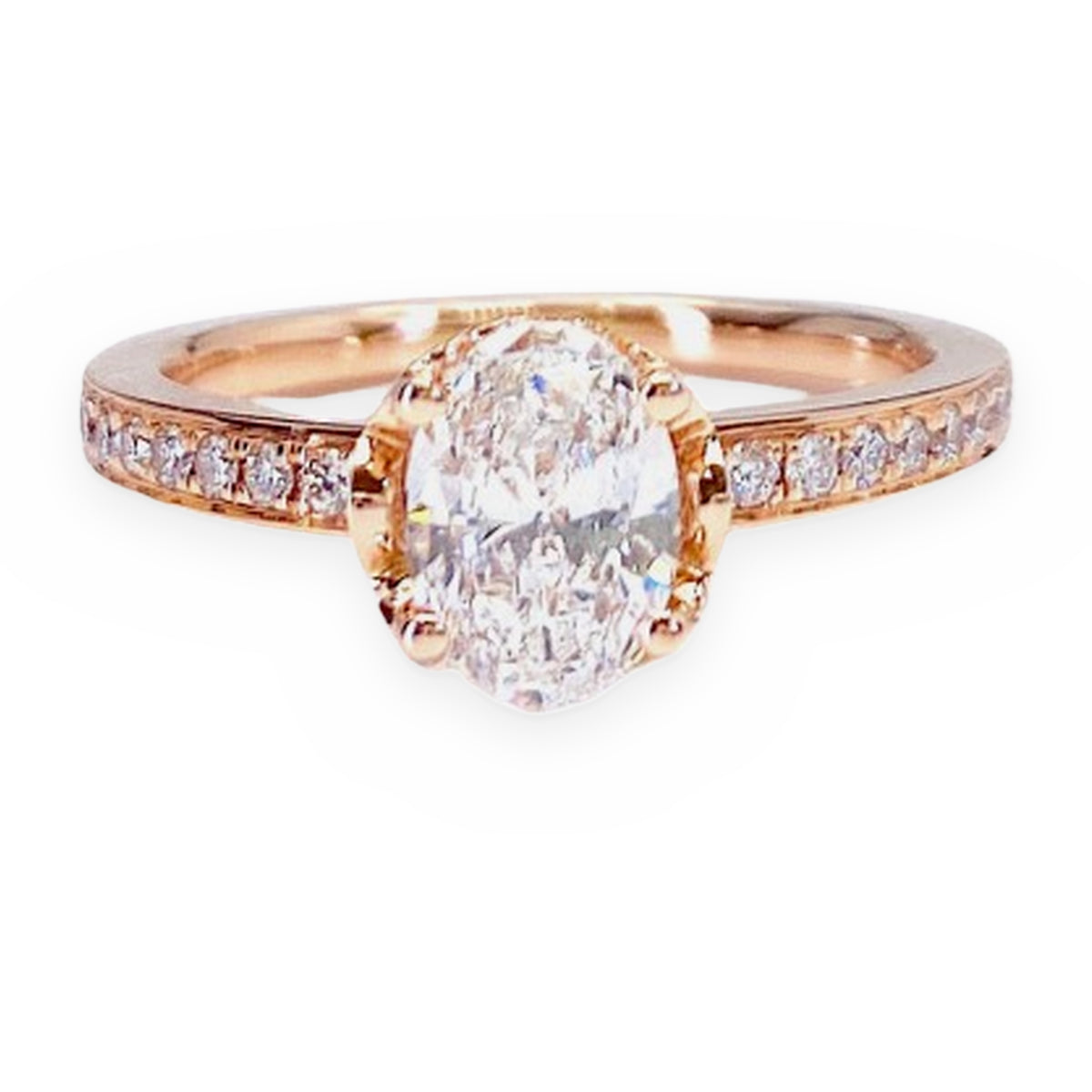 Rose gold oval diamond solitaire engagement ring with diamond-set band, side view