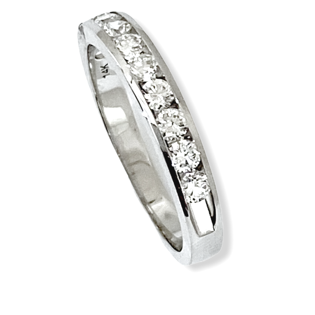White gold channel-set round diamond wedding band, upright three-quarter view