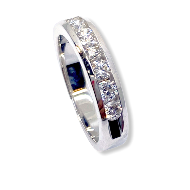 White gold channel-set diamond wedding band, angled view