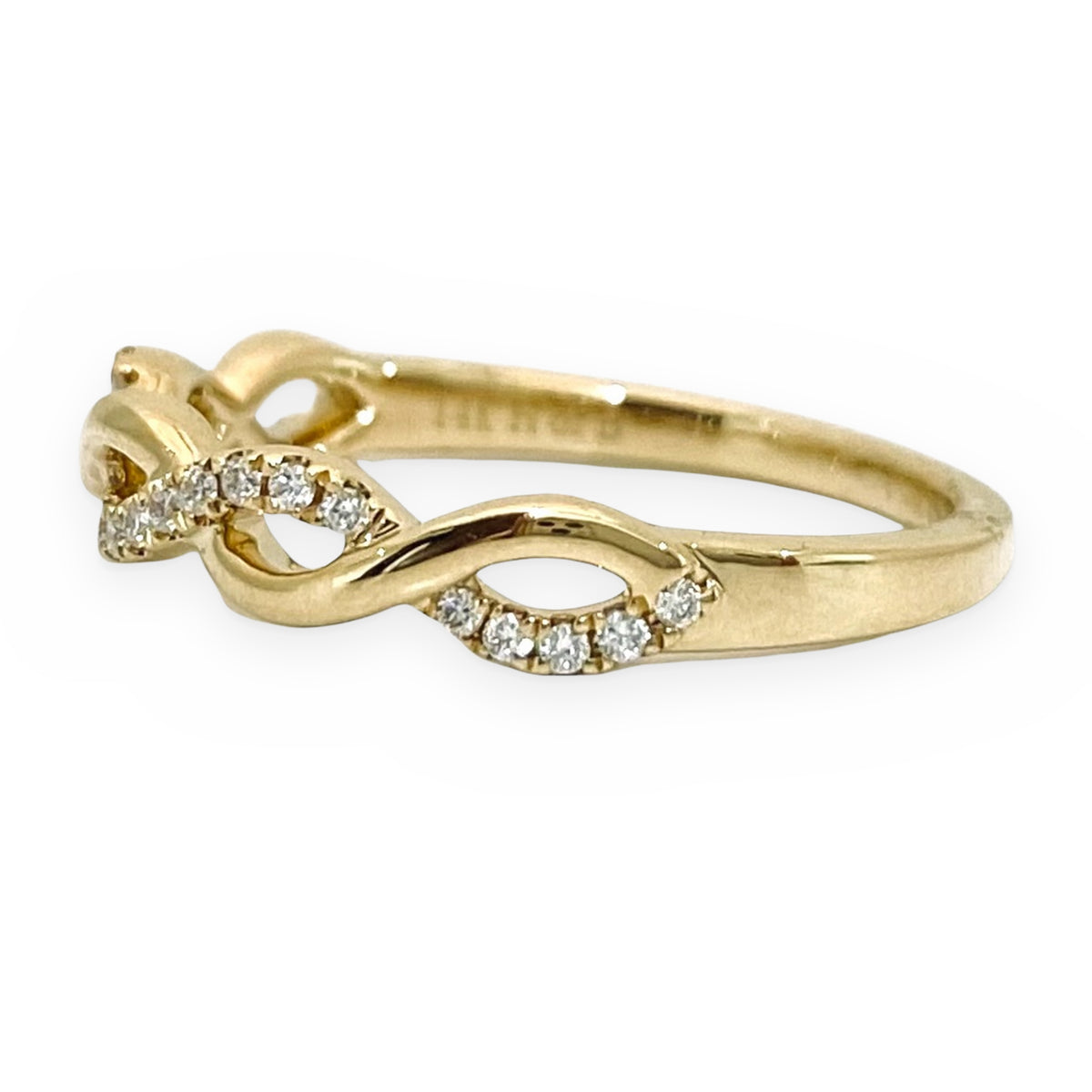 Yellow gold diamond infinity twist band, angled view