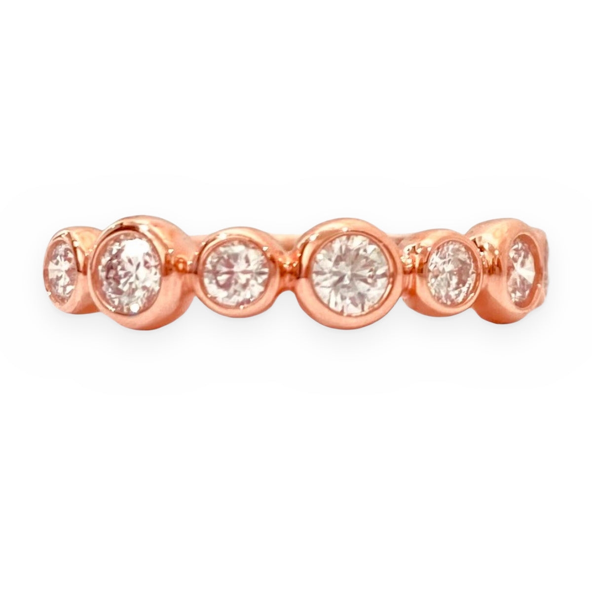 Rose gold bezel-set round diamond band