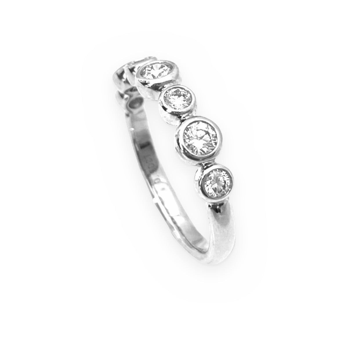 White gold bezel-set diamond band, angled view