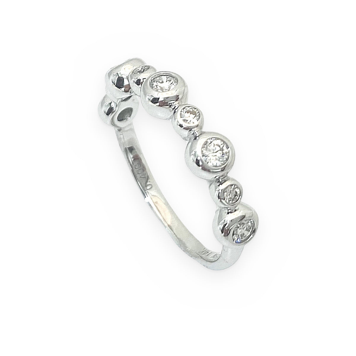 White gold graduated bezel diamond band, angled view