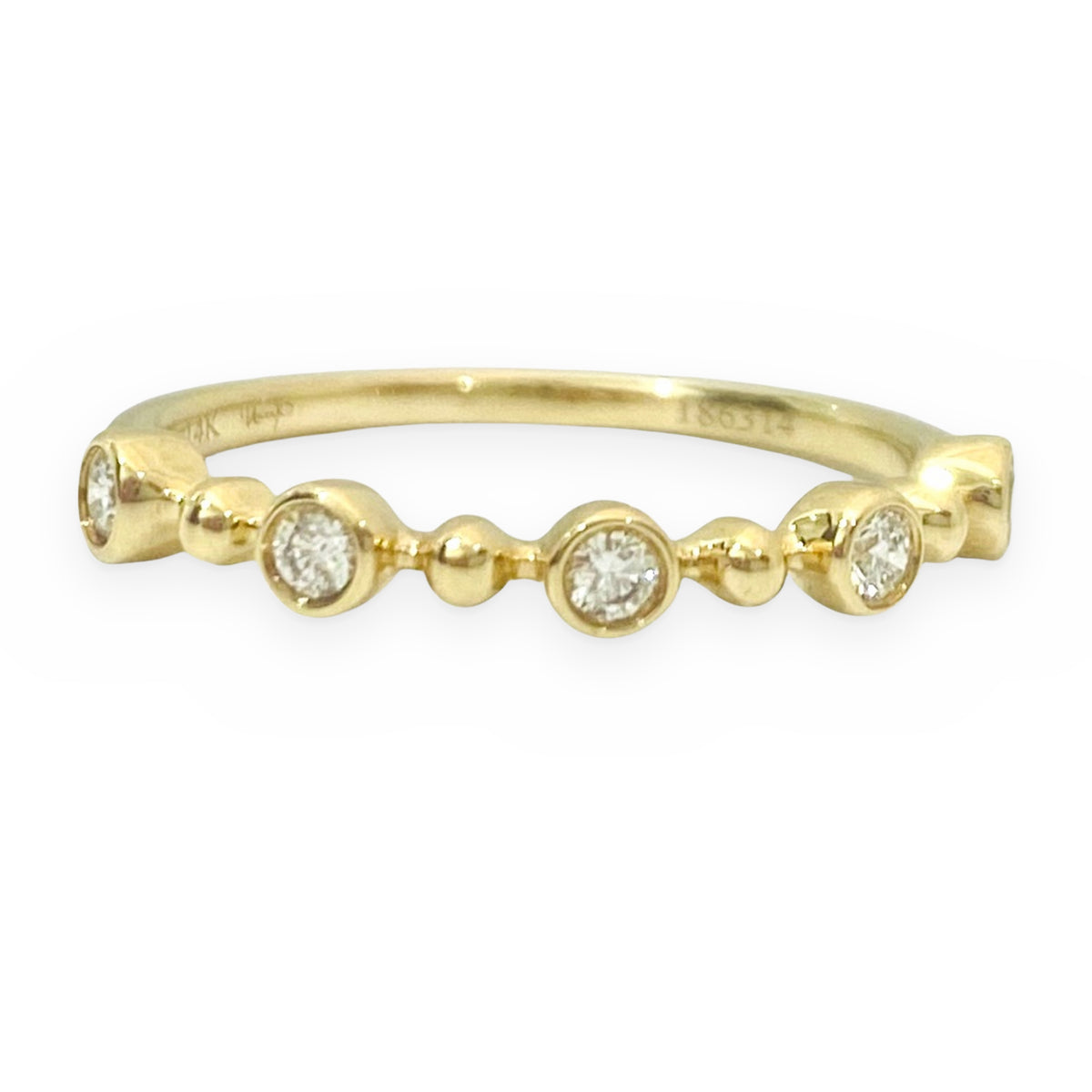 Yellow gold bezel-set round diamond stacking band
