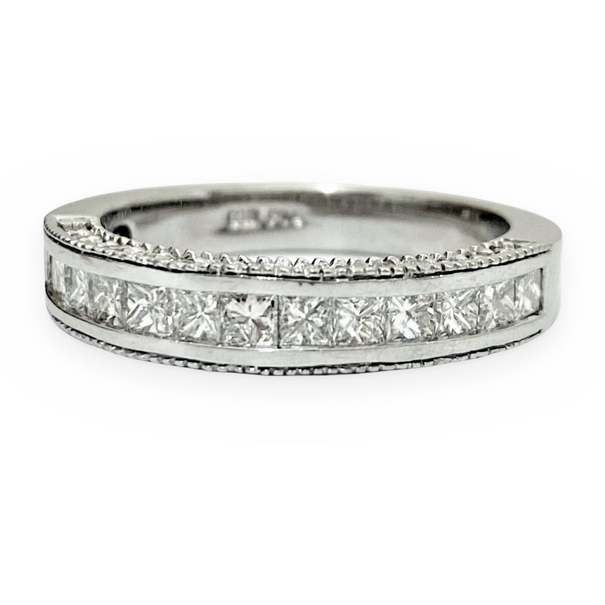 White gold channel-set princess-cut diamond wedding band with milgrain edges