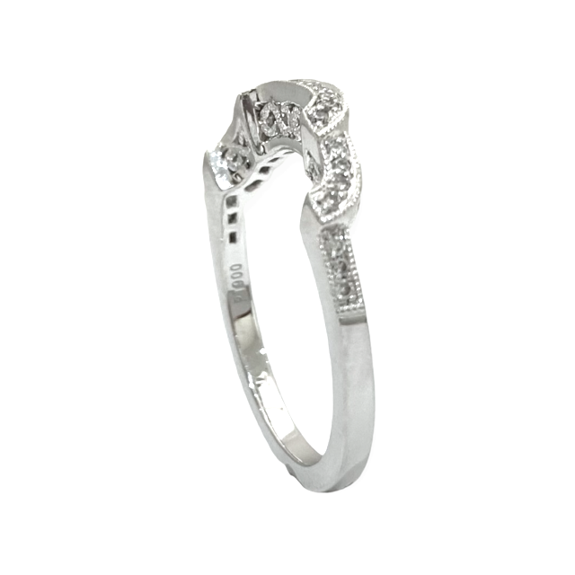 White gold filigree diamond band viewed through the shank