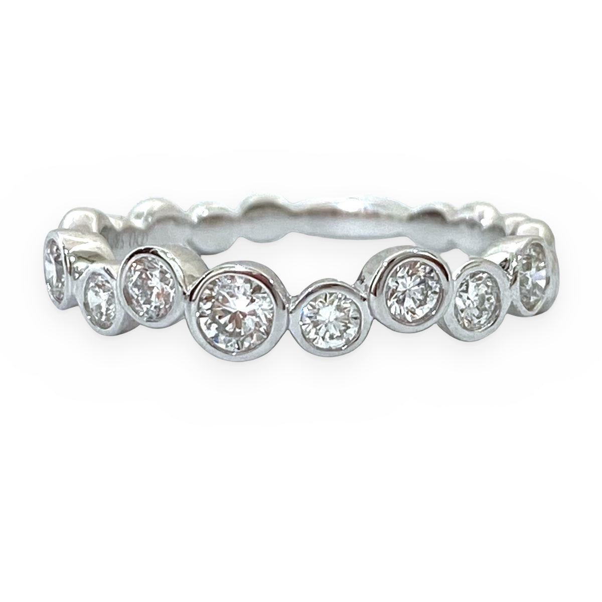 White gold graduated bezel-set round diamond band
