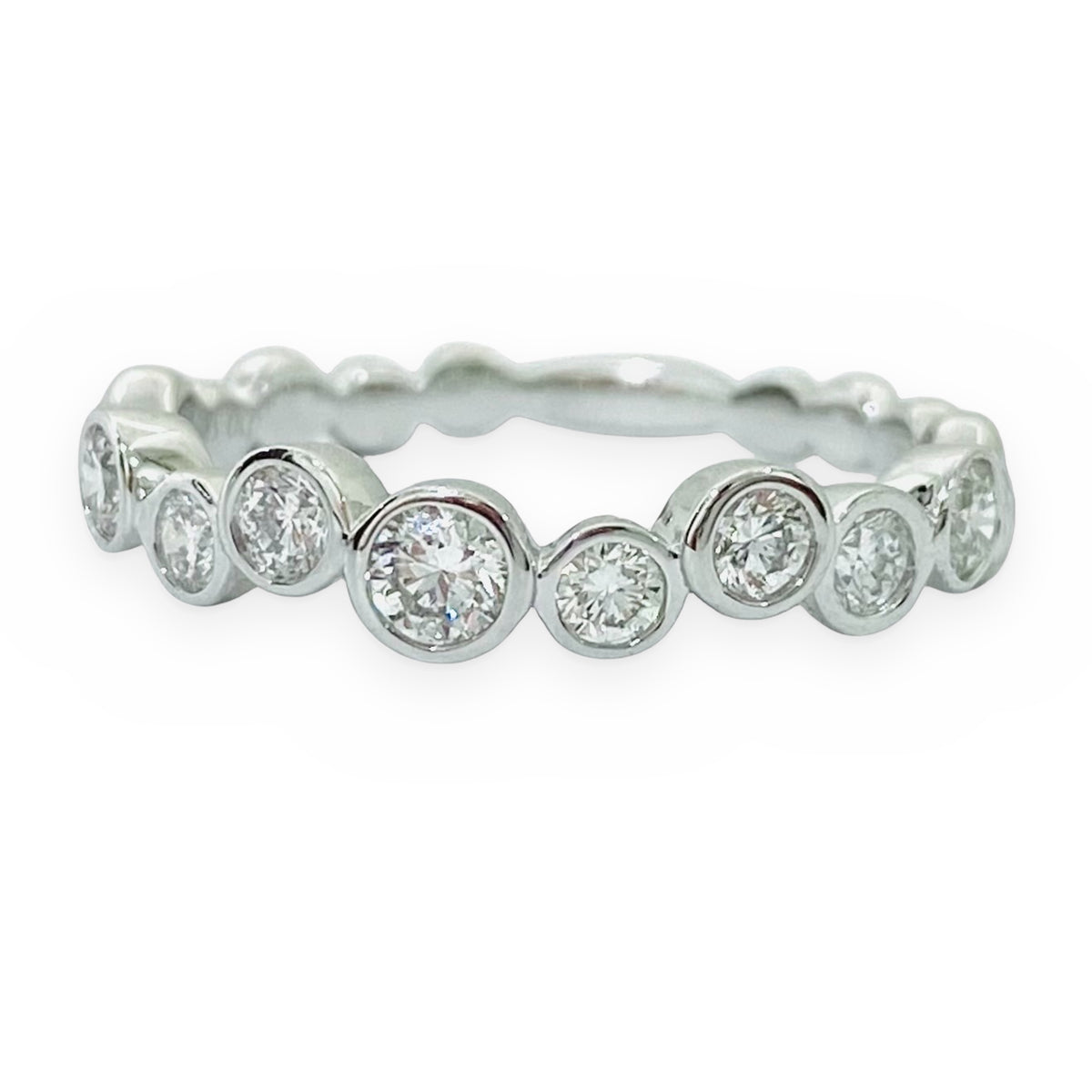White gold graduated bezel diamond band, front view