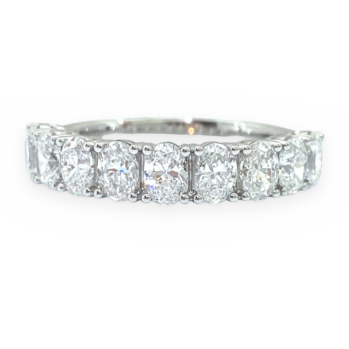 White gold oval diamond band, close-up front view