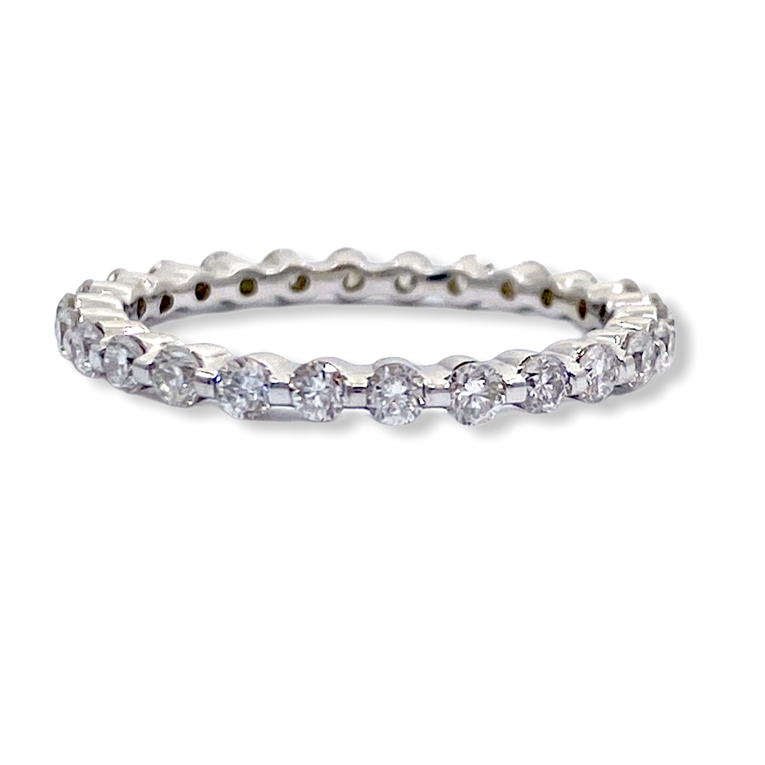 White gold shared-prong round diamond eternity band
