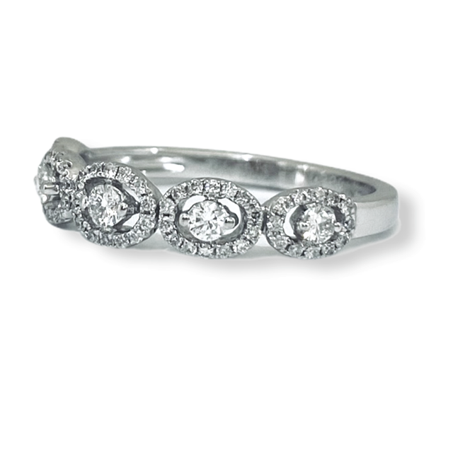 White gold diamond band of oval halos around round diamonds