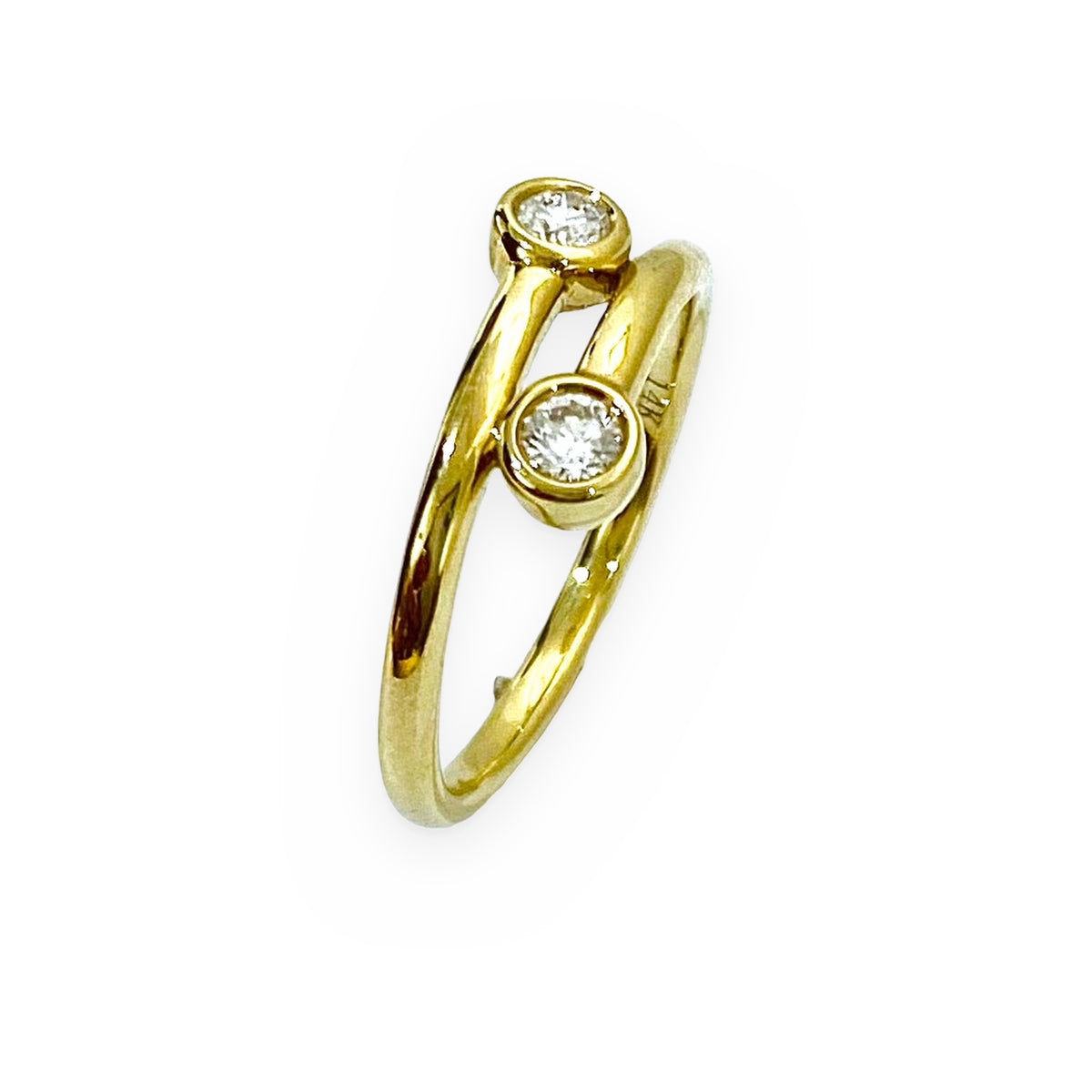 14K yellow gold bypass ring with two bezel-set round diamonds