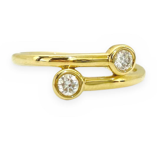 Yellow gold two-diamond bypass ring, front view