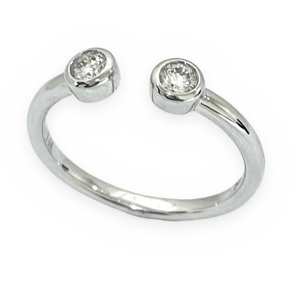 White gold open-cuff ring with two bezel-set round diamonds