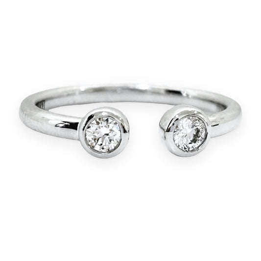White gold open-cuff ring with two bezel-set round diamonds, front view