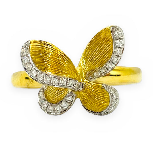Two-tone gold butterfly ring with diamond-outlined textured wings