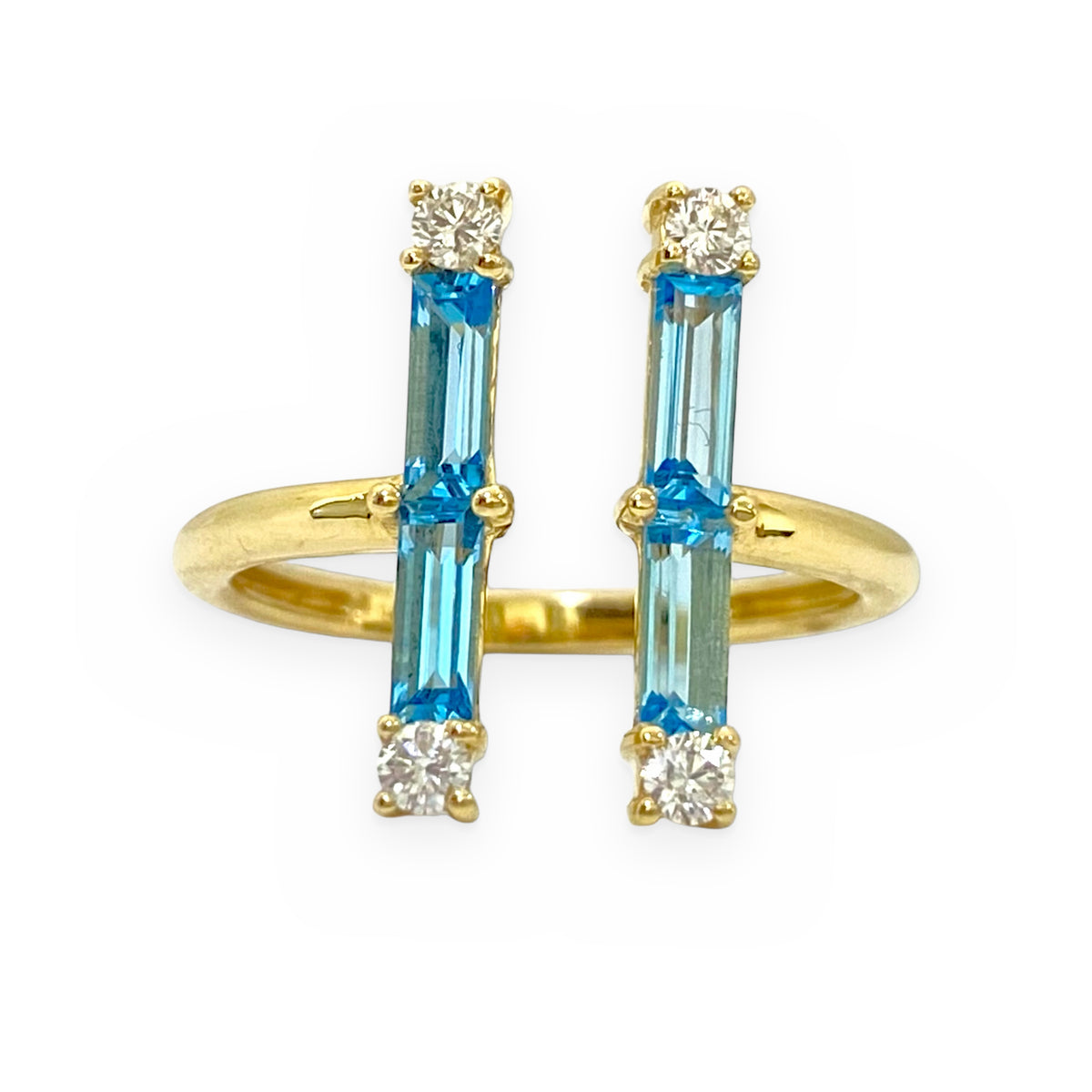 14K yellow gold open double-bar ring with blue topaz baguettes, angled