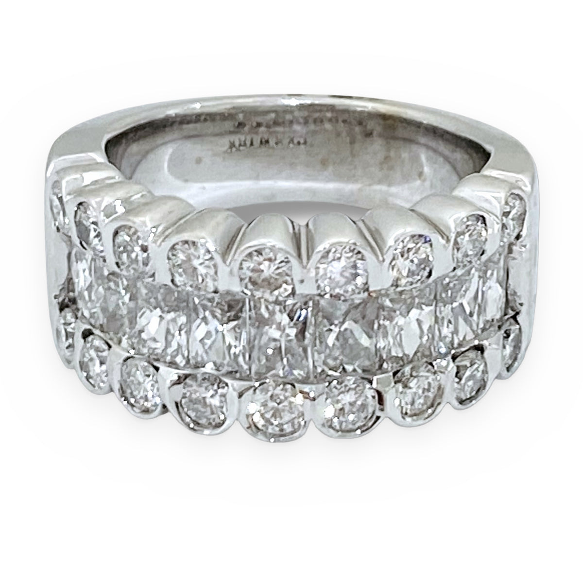 White gold wide band with radiant-cut center row and round diamond edges