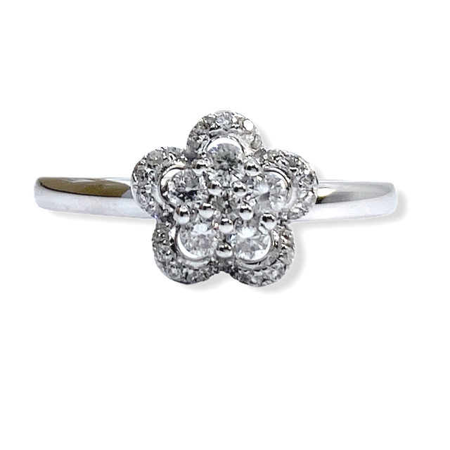 White gold diamond flower cluster ring with quatrefoil openwork petals