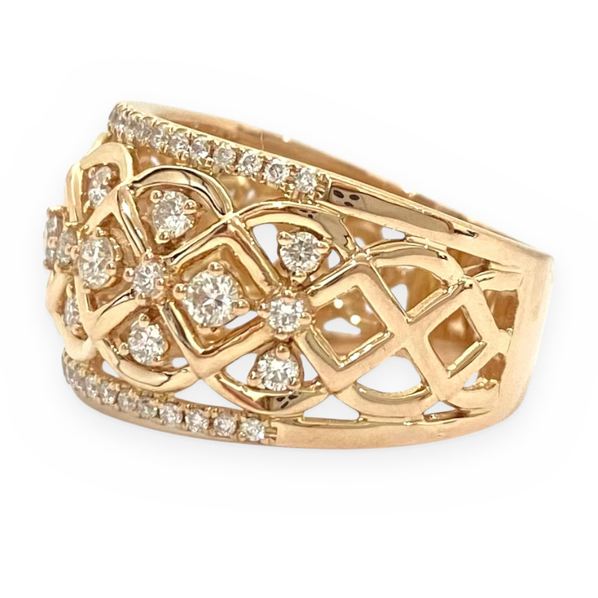Angled view of a rose gold wide band with a diamond lattice openwork pattern