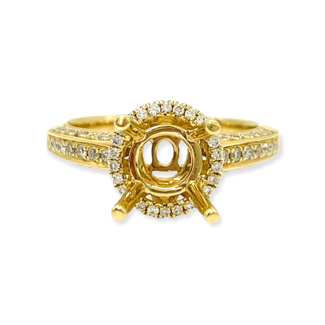 Rose gold round diamond halo engagement ring with a diamond-set band