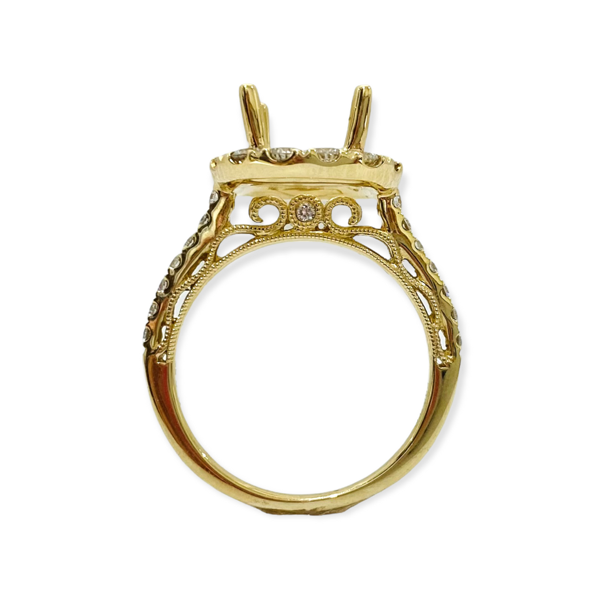 Front view of a yellow gold diamond halo ring semi-mount with empty two-prong center