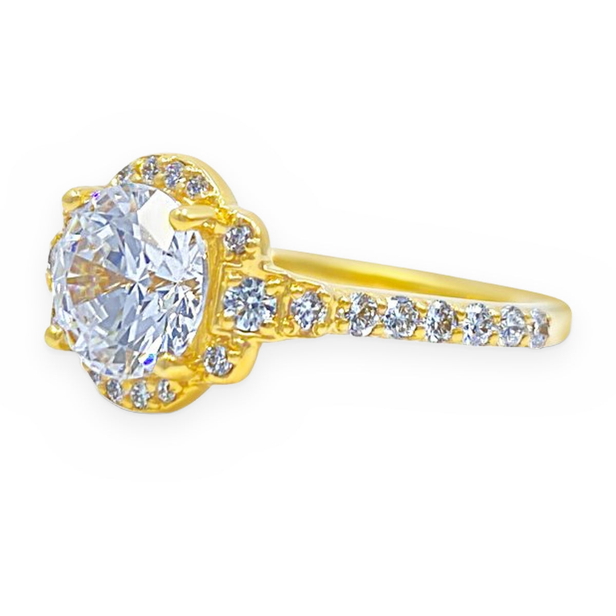 Angled render of a yellow gold halo ring with a round white center stone and diamond band