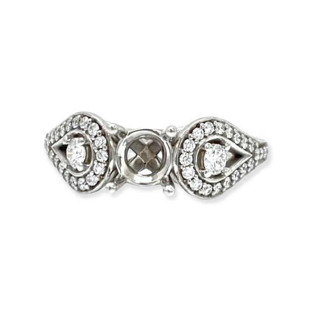 White gold three-stone ring semi-mount with two diamond halos flanking an empty center
