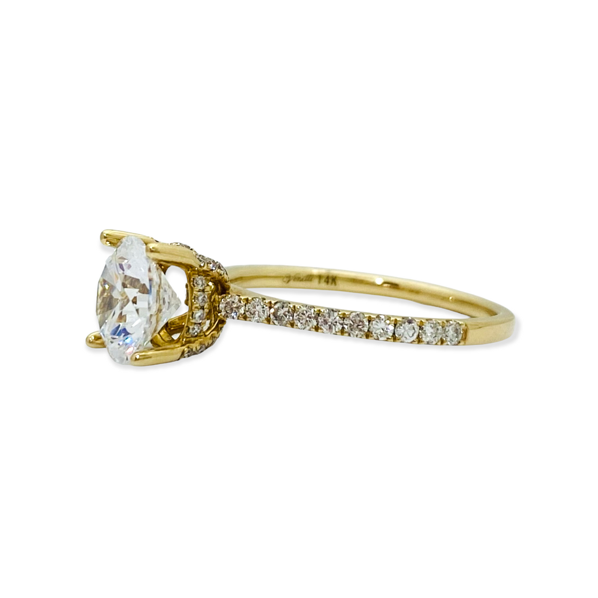 Two-tone yellow and white gold round diamond solitaire ring with a plain rounded band